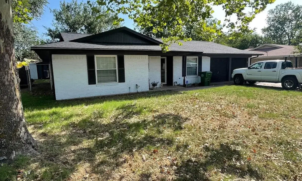 Professional roofing crew working on a residential roof in Duryea